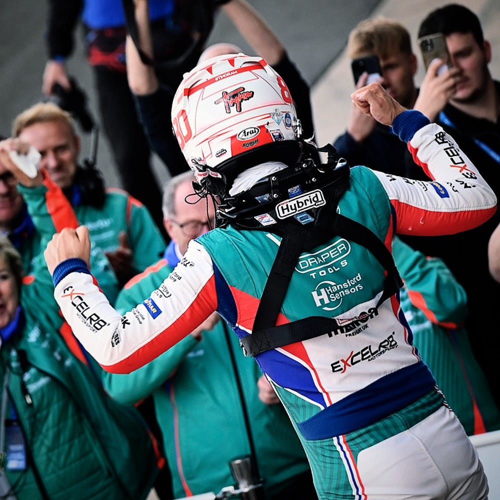 Graphic displaying FIA-approved racing helmet, seat, harness, and fire extinguisher for UK motorsport safety.