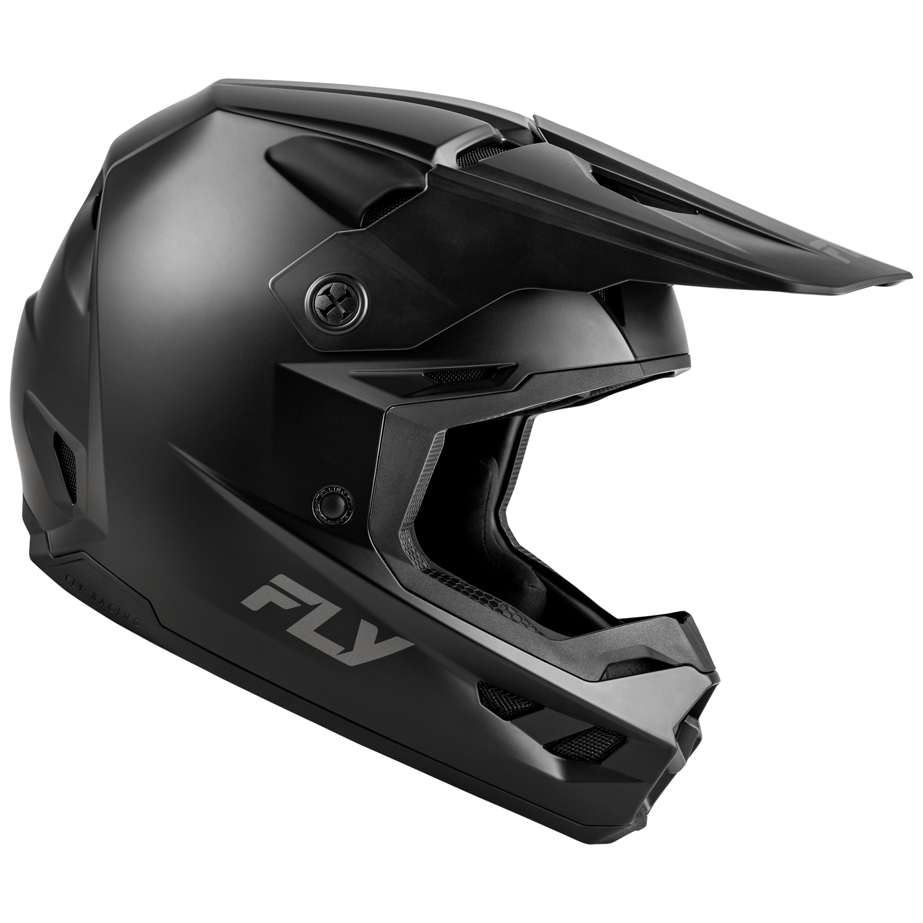 Side view of the matte black FLY Racing Kinetic Solid Youth Helmet, showcasing the aggressive True Functional Ventilation intake ports, sleek solid contour lines, and integrated roost nose guard.