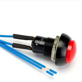 An industrial push-button switch with a red button head, black and silver metal housing, and blue wires, shown on a white background. Cartek Battery Isolator external button in red